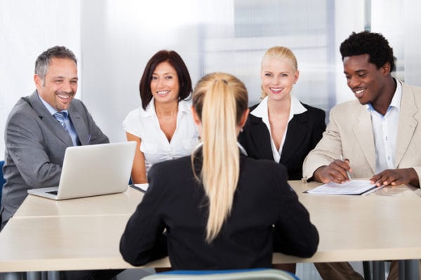 Portrait Of Female Woman Sitting At Interview