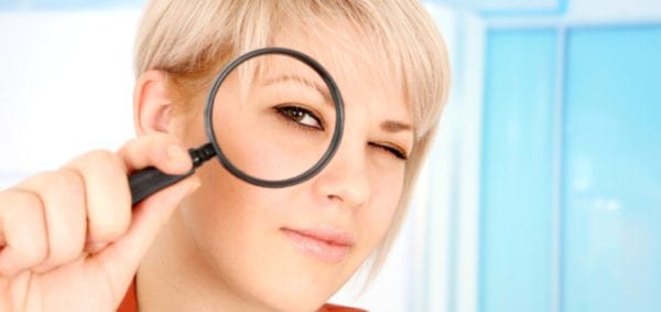 Woman-with-magnifying-glass-720x340